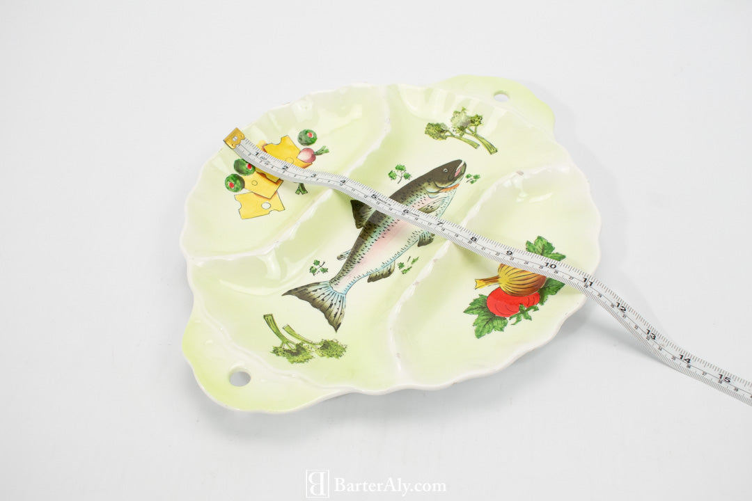 Fish and veggies dinner serving plate appetizers used green