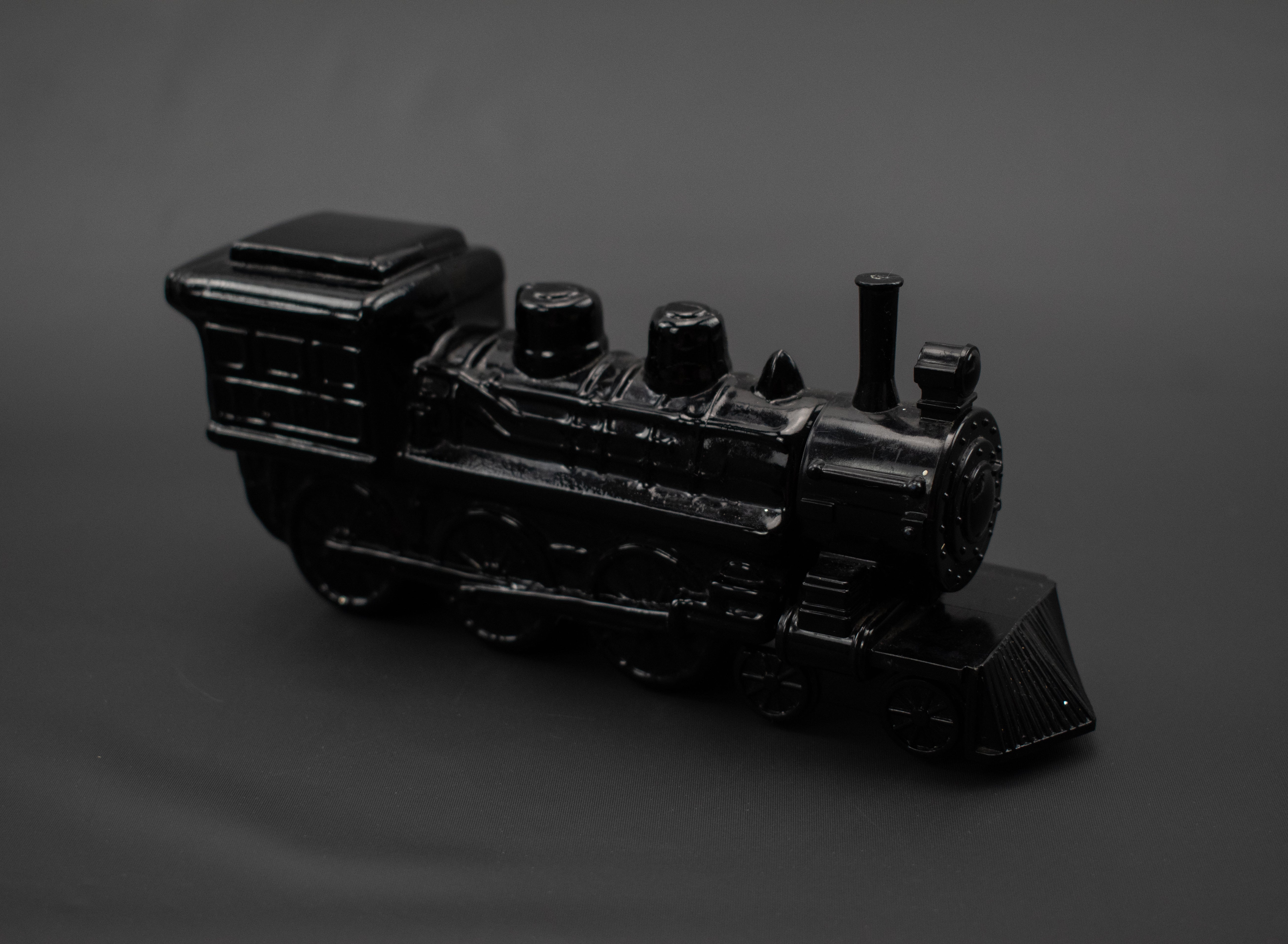 Cannonball Express black train Avon glass bottle used FILLED Vintage Cologne