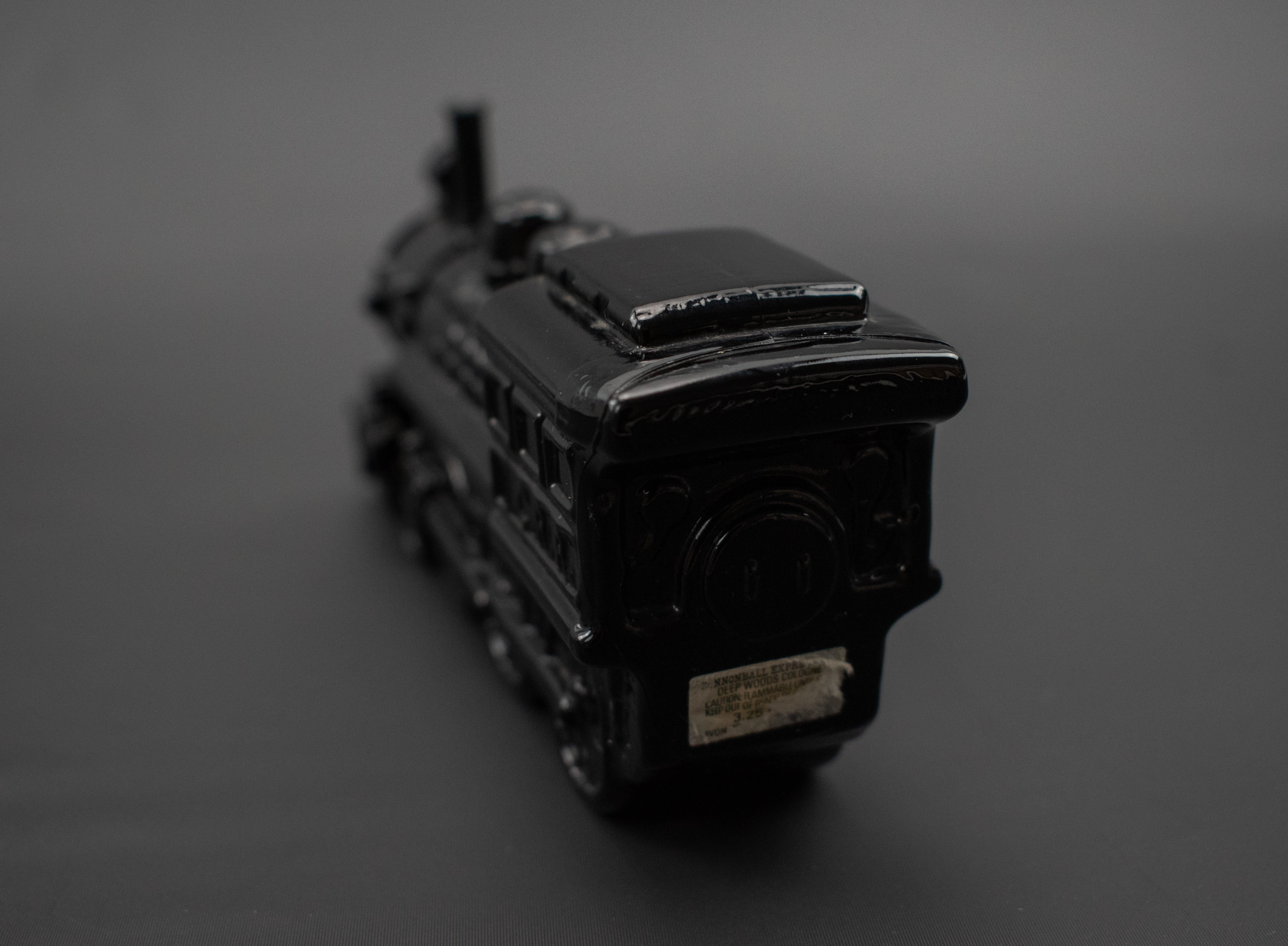 Cannonball Express black train Avon glass bottle used FILLED Vintage Cologne