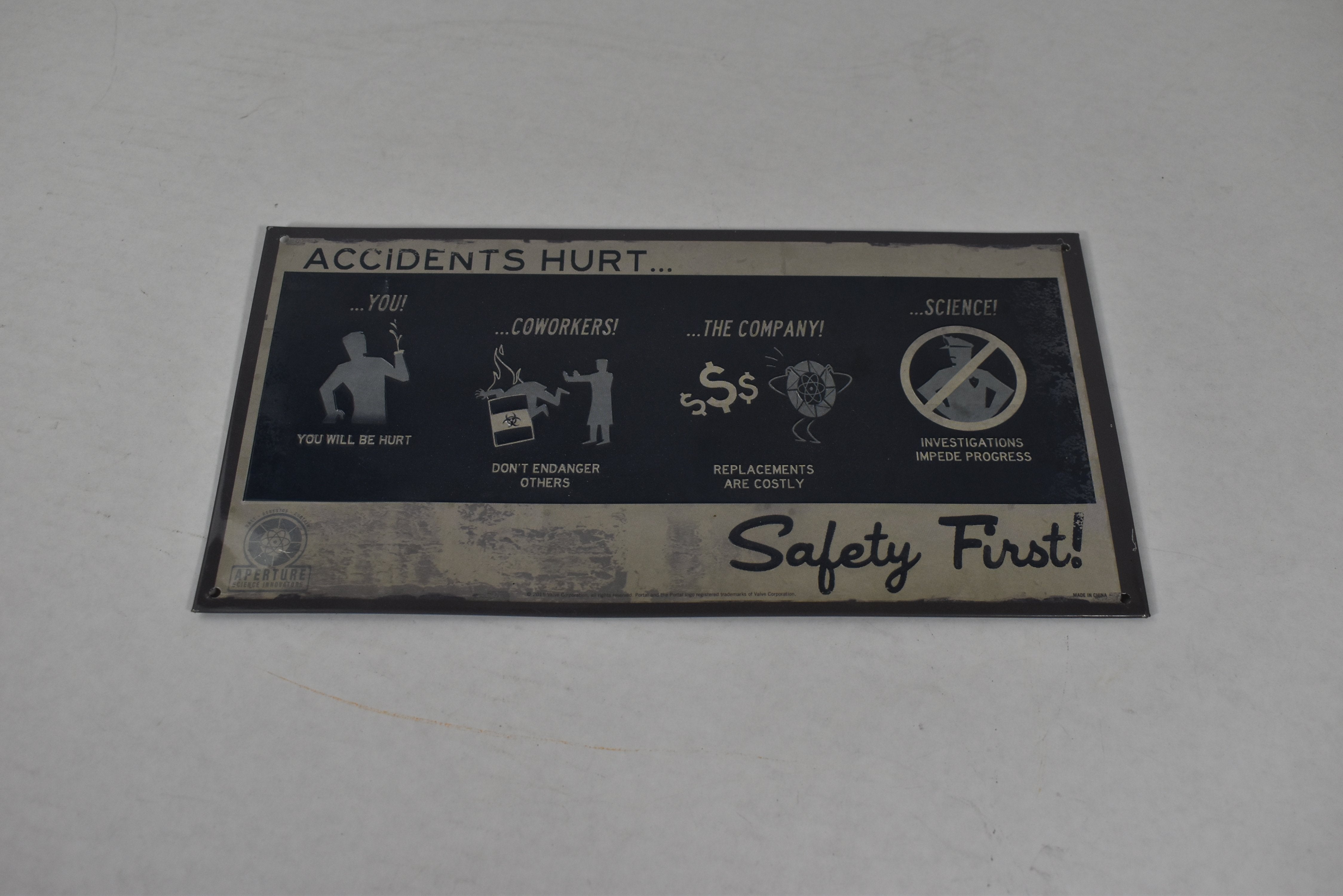 Safety first sign nerd block aperture science innovation 2015