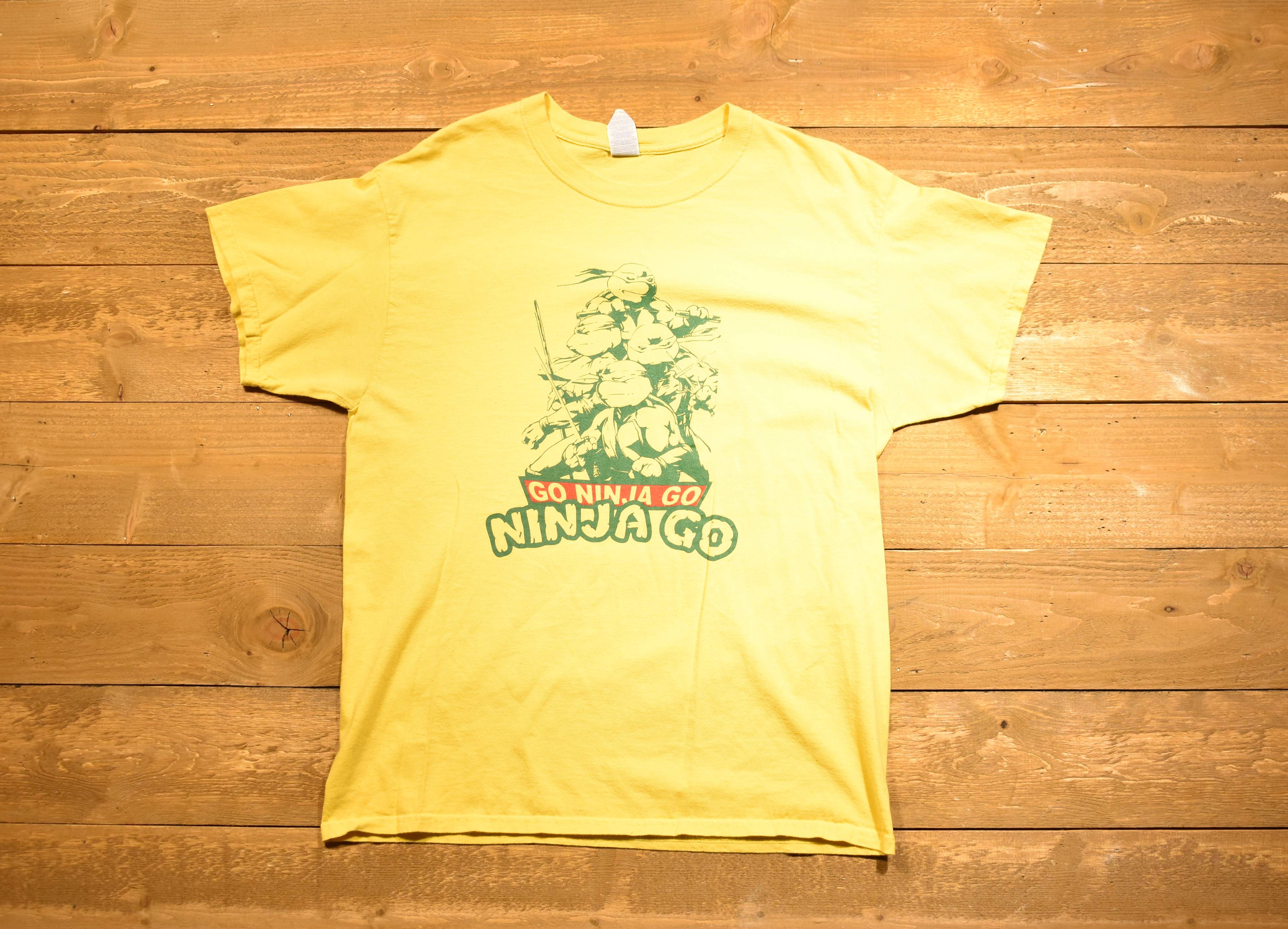 Ninja Turtles men's large yellow T-shirt go ninja go used