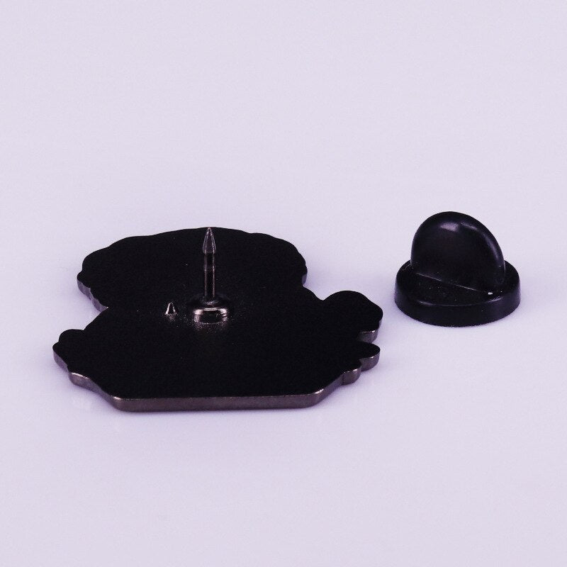 Melting animal badge on volcanic lava dinosaur brooch