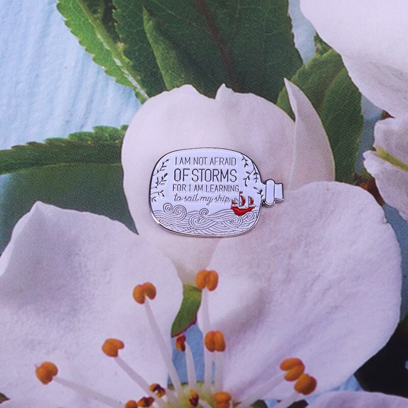 : I am not afraid of the storm, because I am learning to set sail" Sailing Bottle Brooch Positive Courage Badge