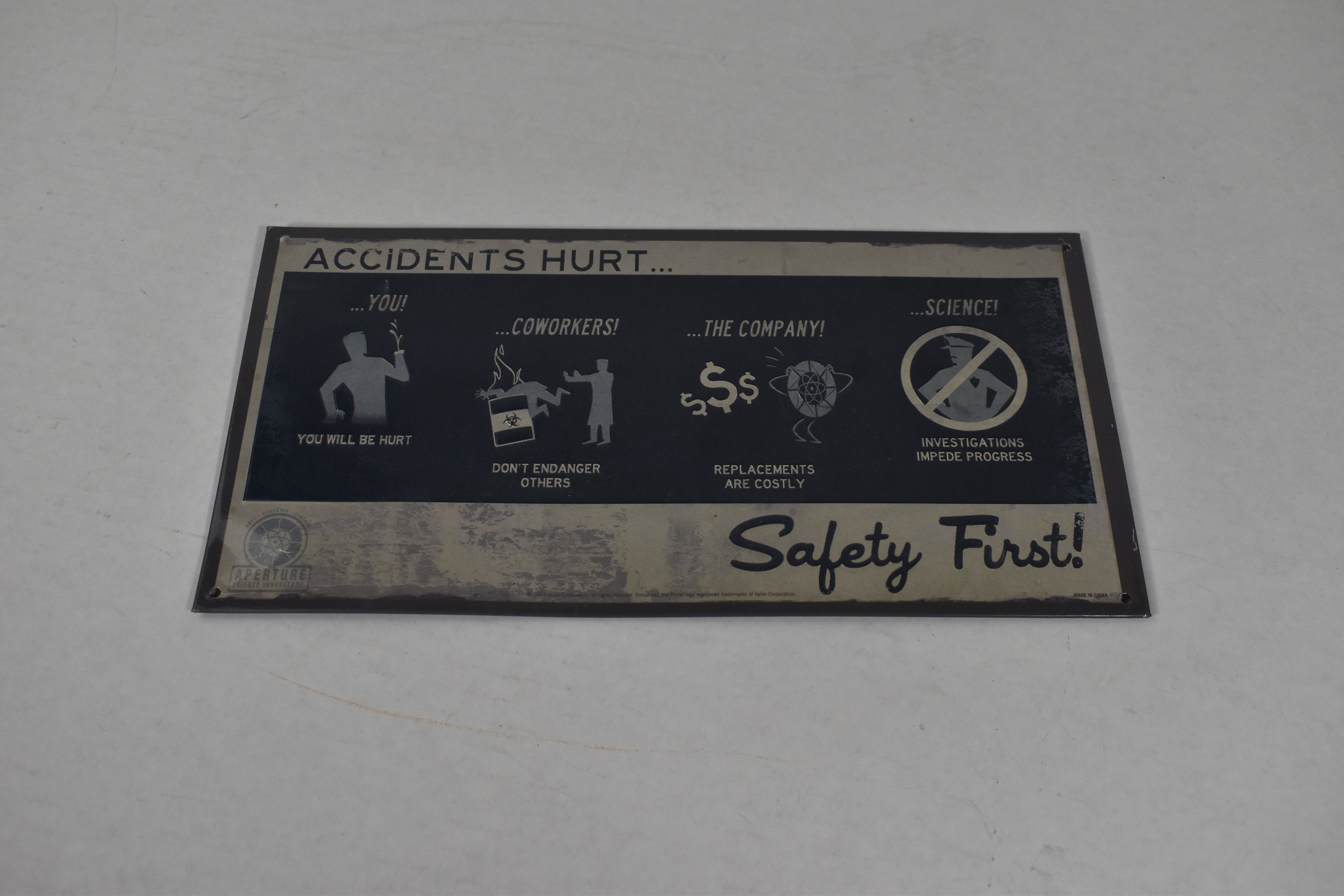 Safety first sign nerd block aperture science innovation 2015