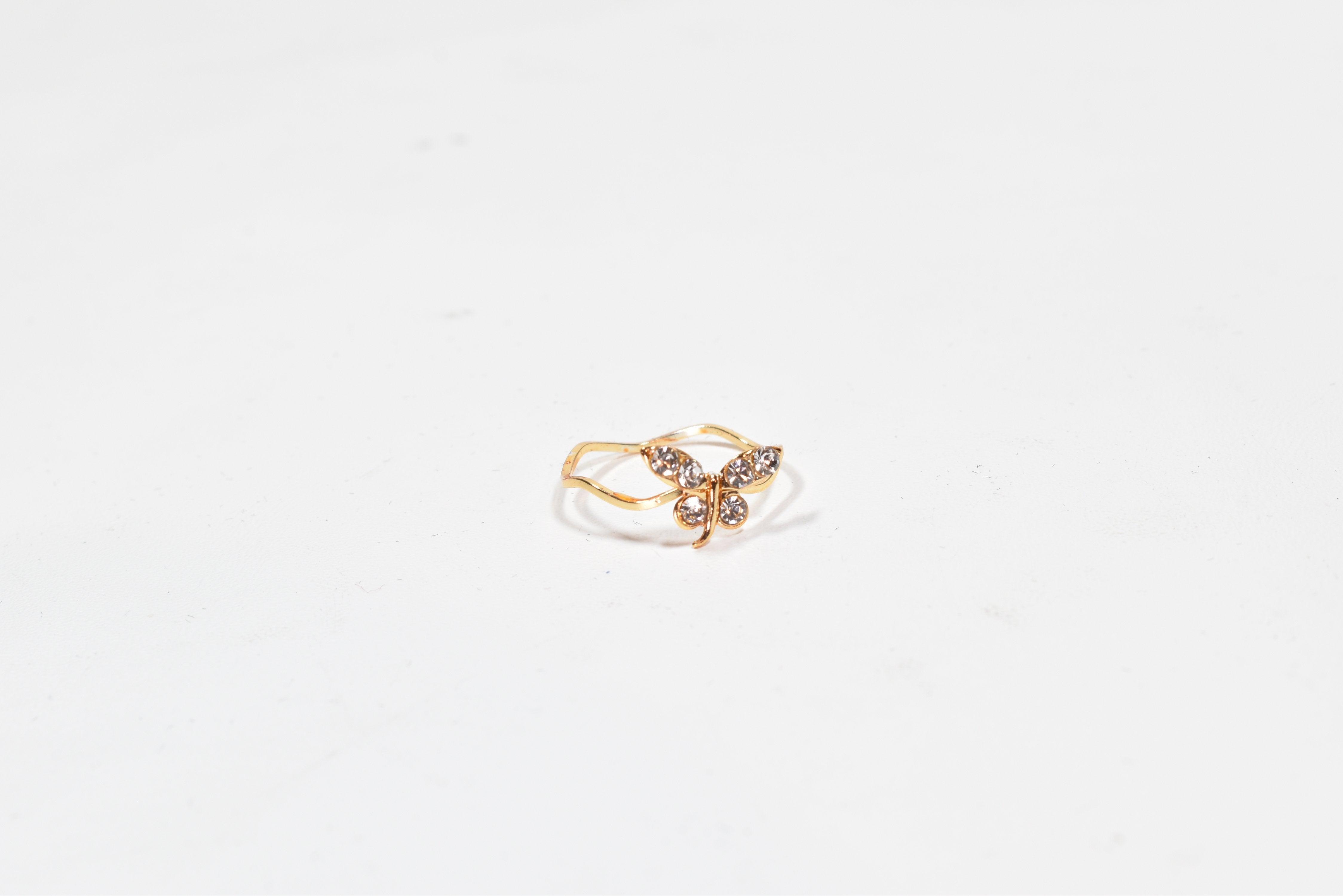 Crystal Butter fly gold band April ring US. Size 7 1/2 Used -00028